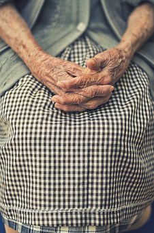 care homes for elderly woman with hands folded